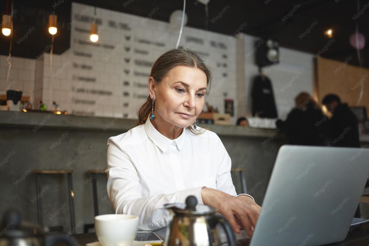 A business owner working at a laptop